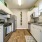 Cozy kitchen space with gray granite countertops and cool lighting