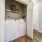 Biltmore Park, NC Townhomes - Reserve at Biltmore Park - a laundry room featuring a washer, dryer, hookups, and a shelf for storage