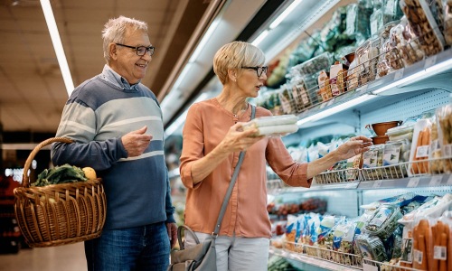 a man and woman grocery shopping