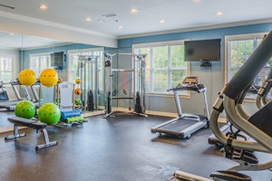 Fitness center with large mirror and windows for lighting