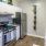 Cozy kitchen space with gray granite countertops and cool lighting